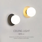 Opal Brass Frosted Globe Wall Sconce