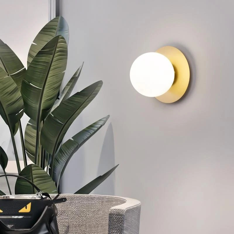 Opal Brass Frosted Globe Wall Sconce