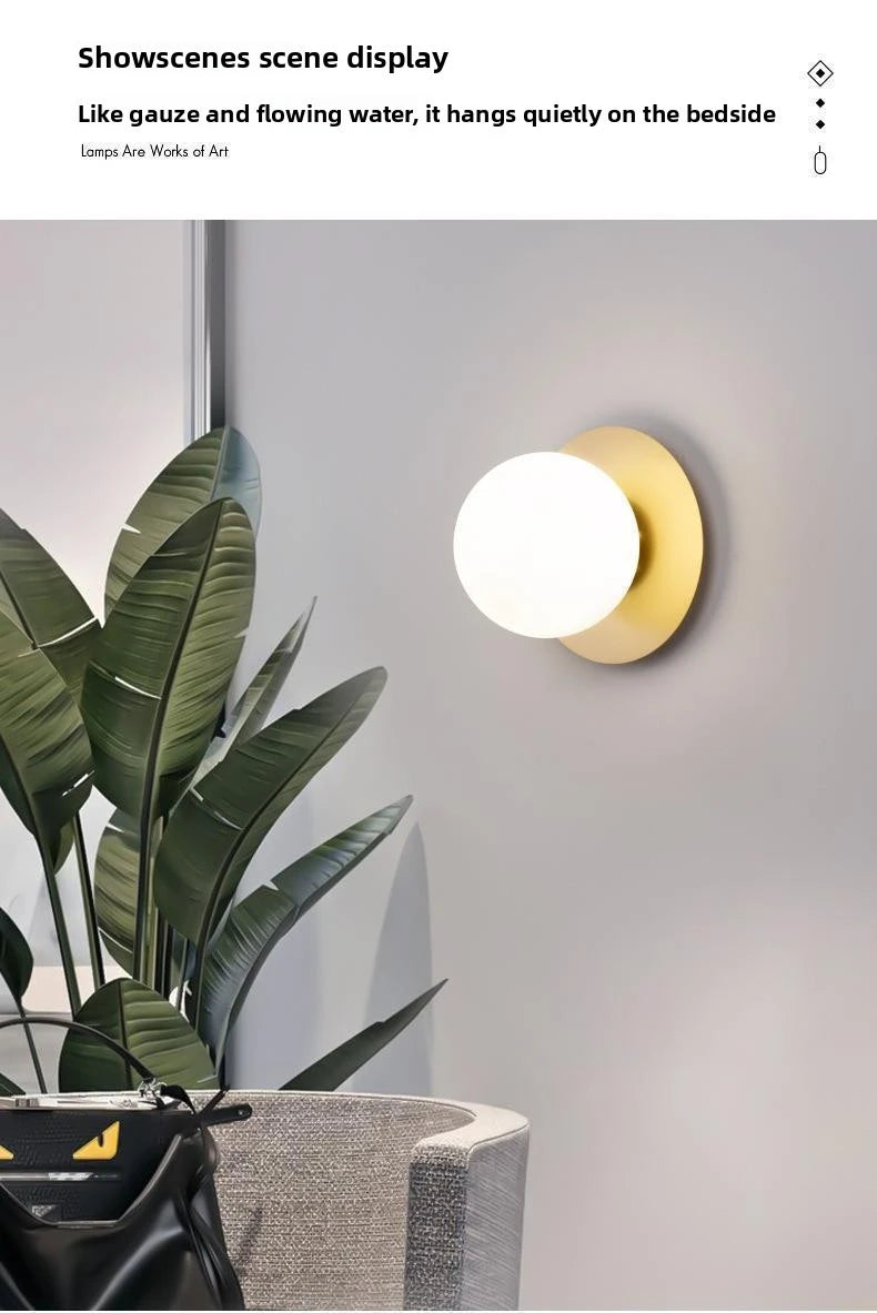 Opal Brass Frosted Globe Wall Sconce