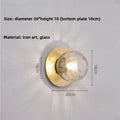 Opal Brass Frosted Globe Wall Sconce