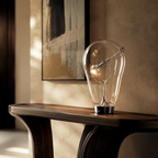 Aurelia Glass Table Lamp on a dark wood console