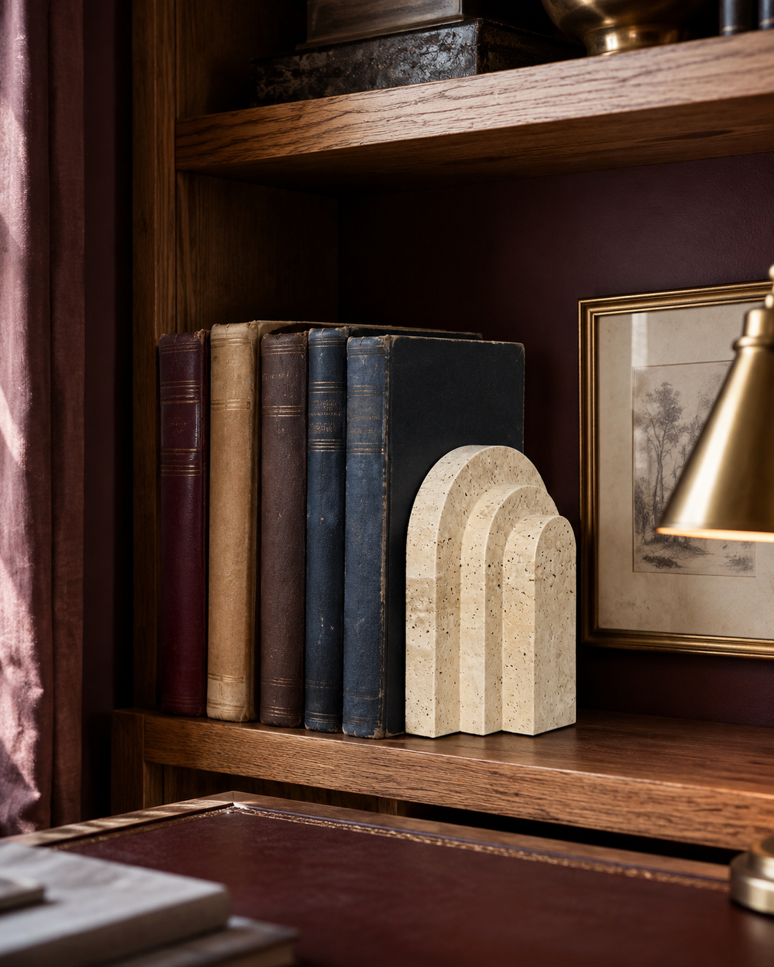 Cove Natural Travertine Bookend in a cozy plum-walled study