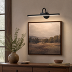 Dorian Rechargeable Picture Light accurately represented in a cozy Vale & Lume interior
