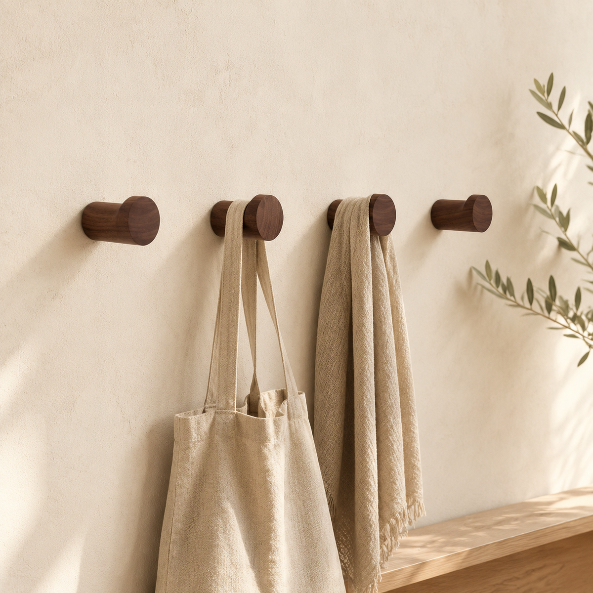 Everett dark walnut wall hooks with short cylindrical bodies and round front lips