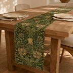 Flora botanical linen table runner draped naturally over the end of an oak dining table