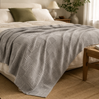 Maren Cotton Waffle Throw in light grey with its authentic waffle-grid and geometric woven texture, styled in a warm Vale & Lume bedroom