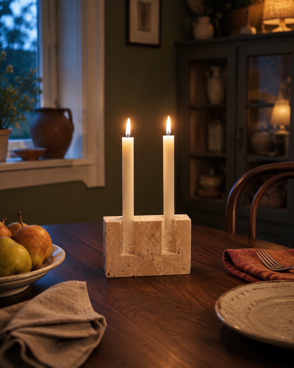 Noma Travertine Candleholder styled on a cozy evening dining table