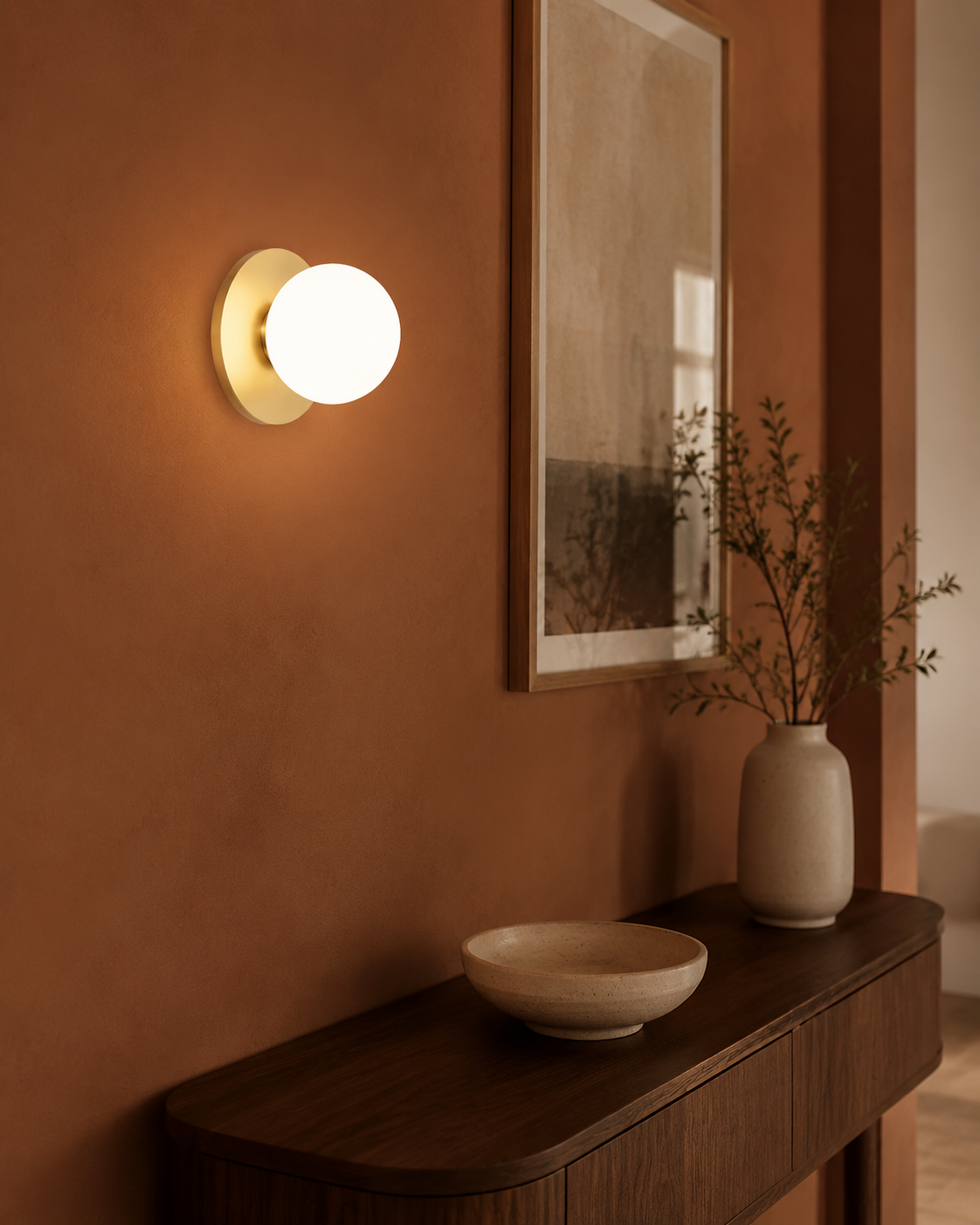 Opal Brass Frosted Globe Wall Sconce styled in a warm Vale & Lume interior