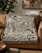 Veda Abstract Jacquard Woven Throw styled in a warm Vale & Lume interior